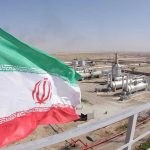 Iran’s Water Supply COLLAPSES Iranian flag near an industrial gas refinery.