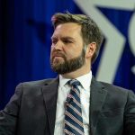 MAGA Implodes! Was Vance BETRAYED? Man in a suit with a thoughtful expression.