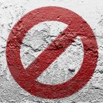 A Paint Color Just Became An Absurd New Culture War A red prohibition symbol on a textured white wall