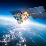 Space Debris Tracked in Real-Time Satellite orbiting Earth with moon in background.