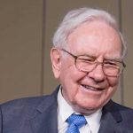 Buffett’s INSANE Tax Plan Warren Buffett smiling during a public appearance