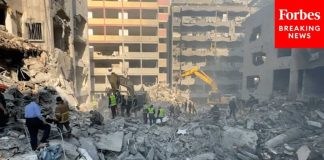 Emergency Personnel In Southern Beirut Deal With The