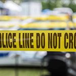 HORROR In The Woods: Husband’s Chilling Final Act Yellow police line tape with Do Not Cross.