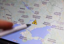 Map of Ukraine with nuclear warning symbol.