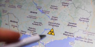 Map of Ukraine with nuclear warning symbol.