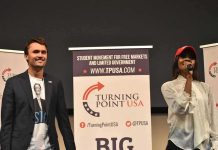 Kirk’s Juggernaut Moves Gen Z Right Curro Savoy at a TPUSA event with another speaker on stage